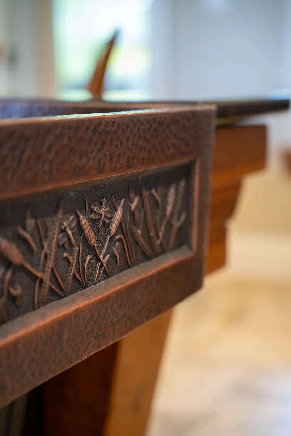 Carved copper sink edge and custom metalwork