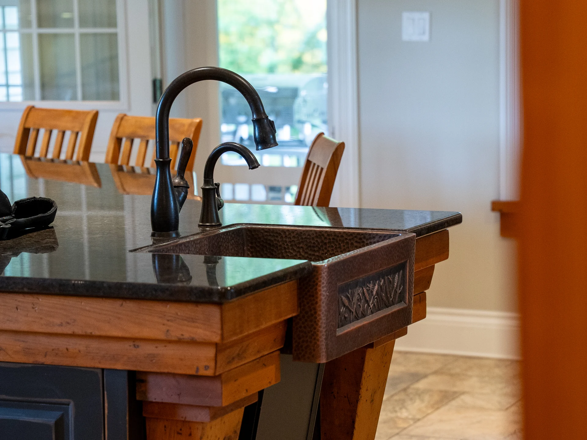 Hammered copper sink and dark countertop